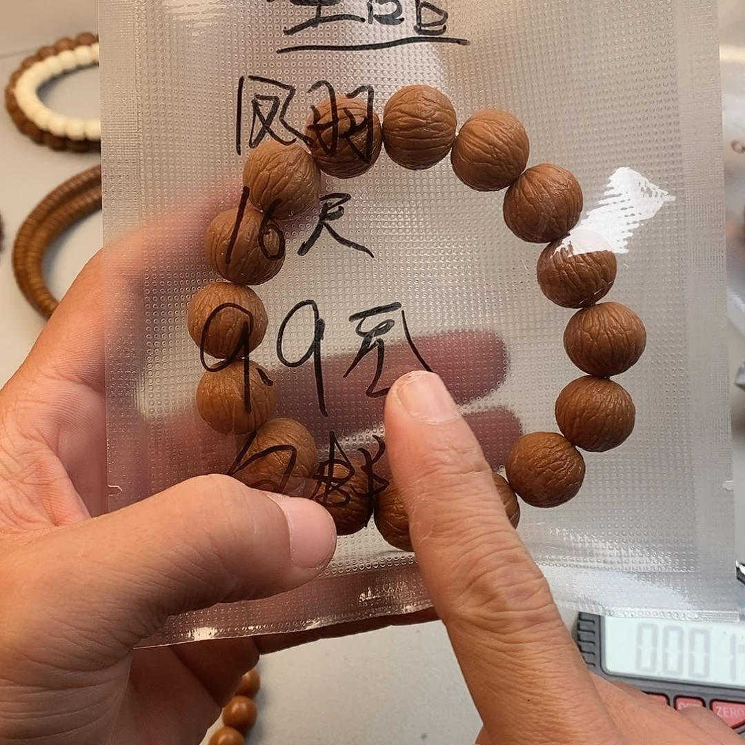 吊坠猴头核桃凤羽手串