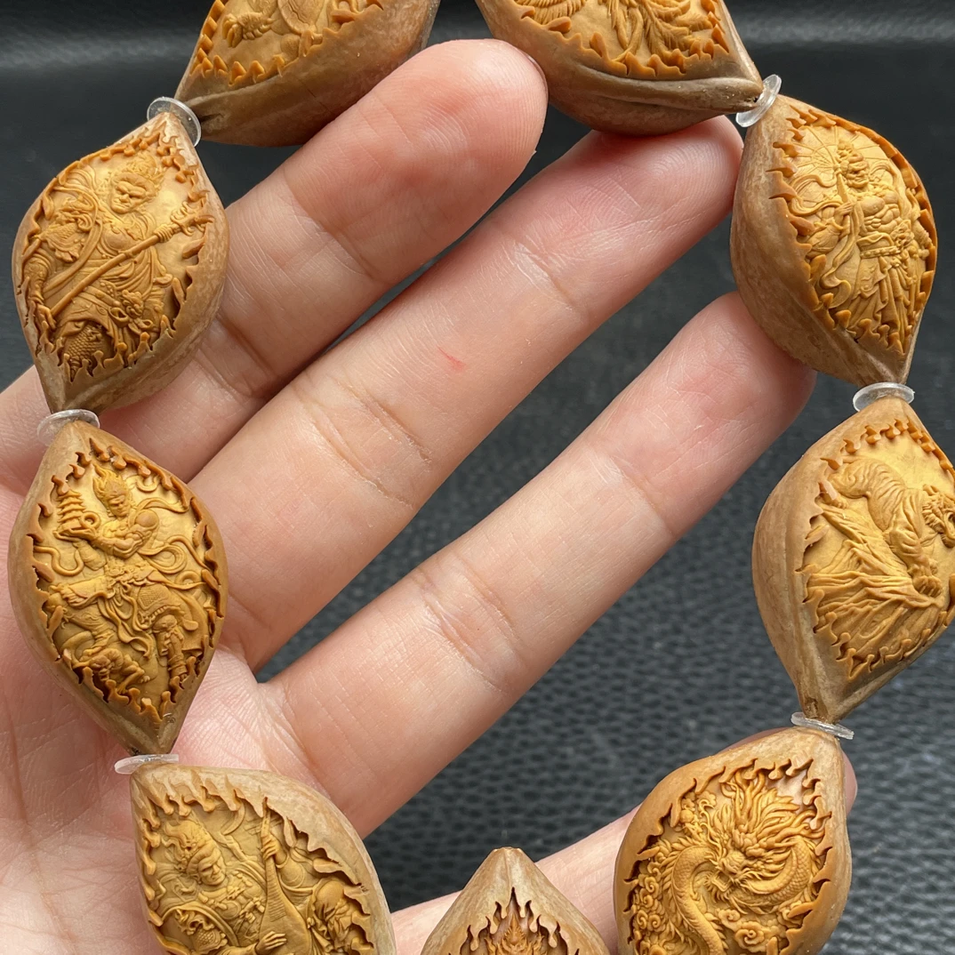 新款橄榄核铁核2.1浮雕四大天王手串