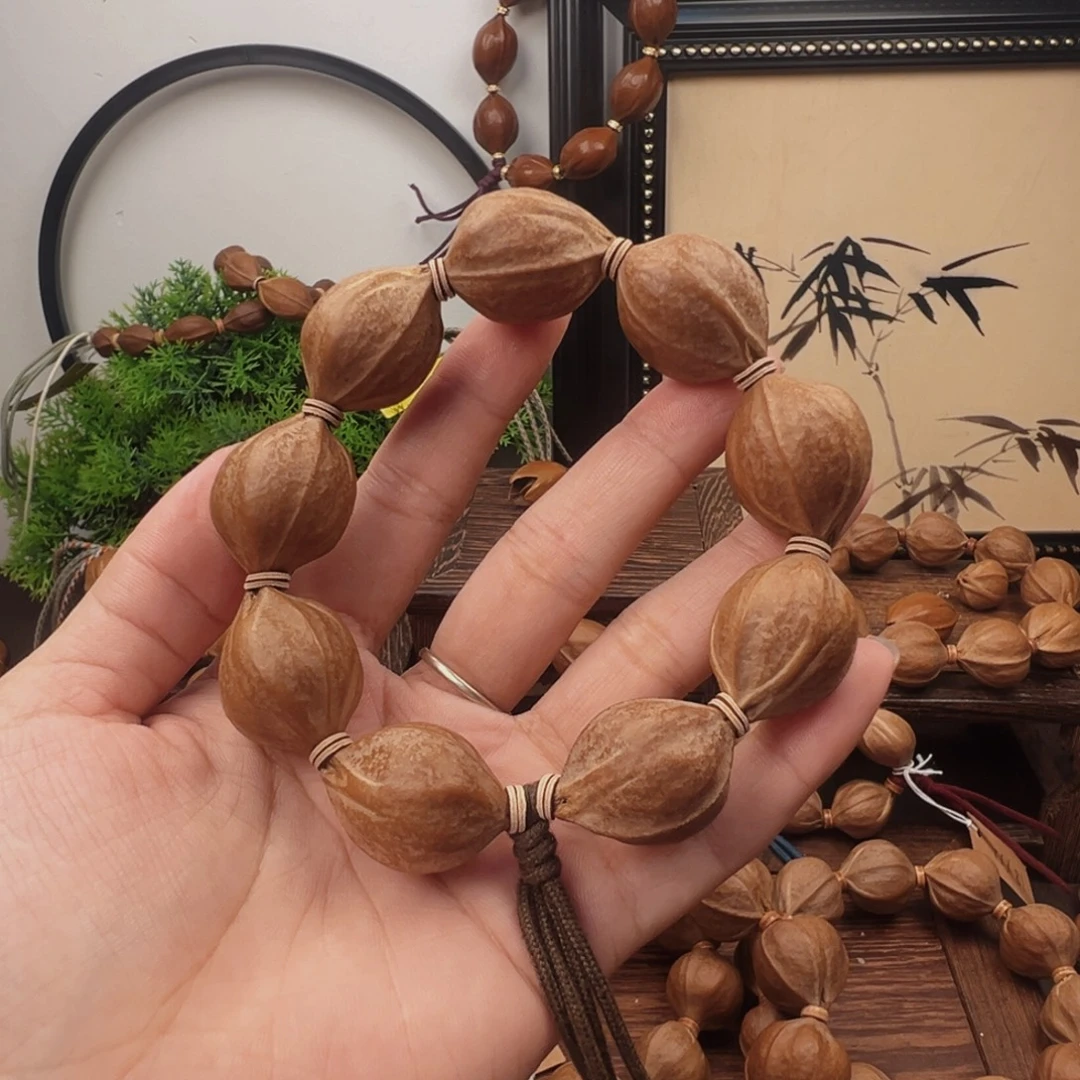 @***旭手串橄榄核21.27梅林铁核