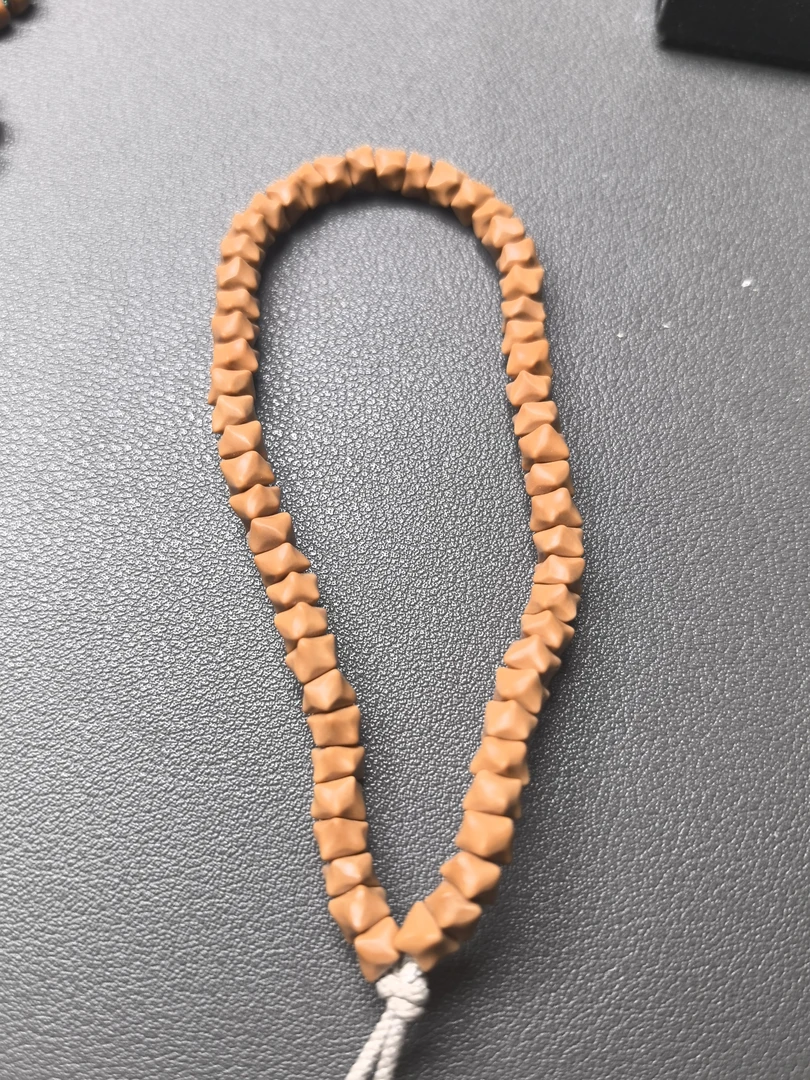 老挝料核尖龙骨手持58