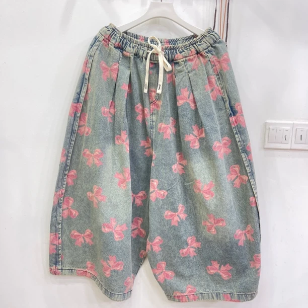 427欧货爆款牛仔印花蝴蝶结图案大版牛仔八分裤女