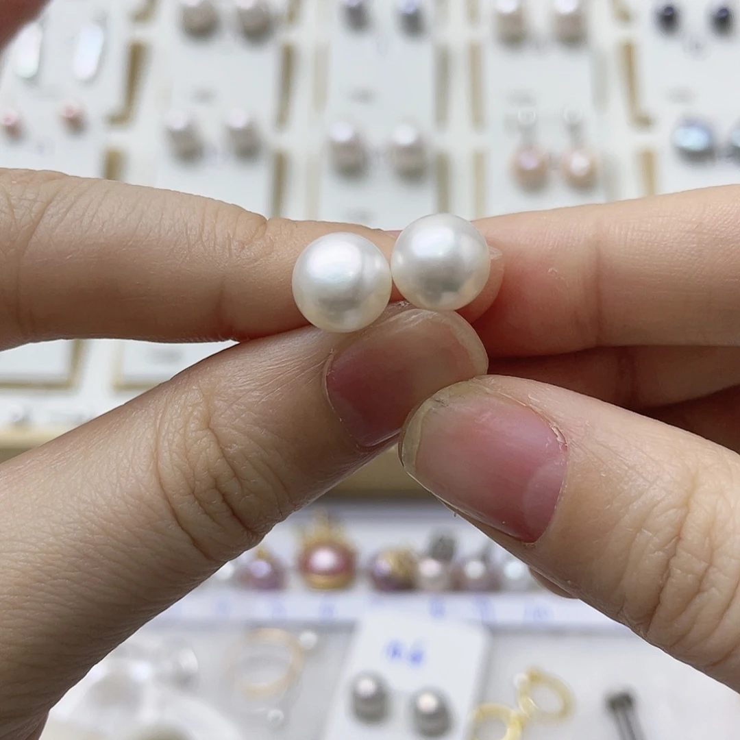 艳***蝶淡水珍珠银S925镶嵌耳饰