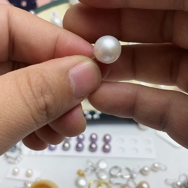 炅***淡水珍珠银S925镶嵌耳饰