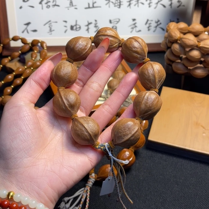 九***歌手串/手链橄榄核23.28精品梅林铁核