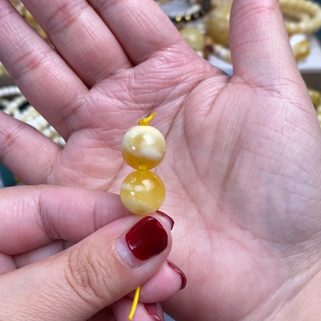 琥珀裸石未镶嵌(****金瓷白圆珠对珠12.8mm