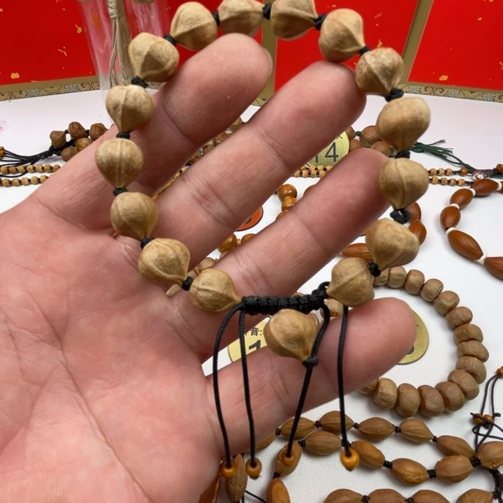 到***高橄榄核手串闪电购2