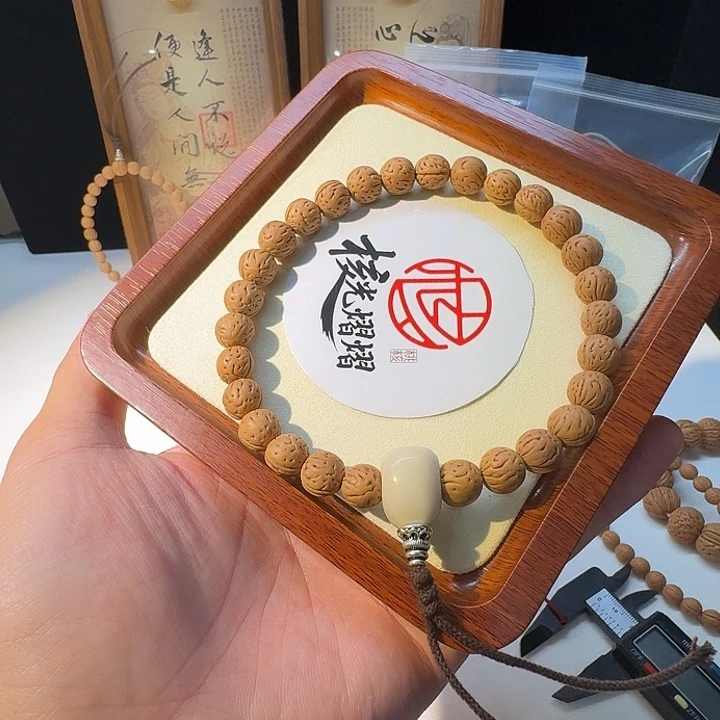 郭***汉吊坠桃核野生小黄桃
