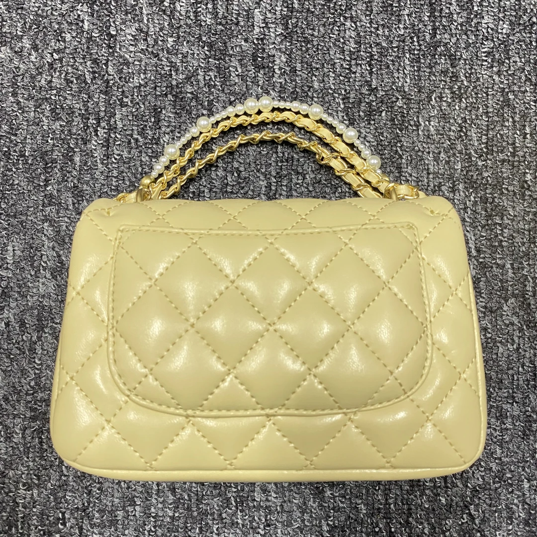 姝宴真皮女包珍珠胖黄色