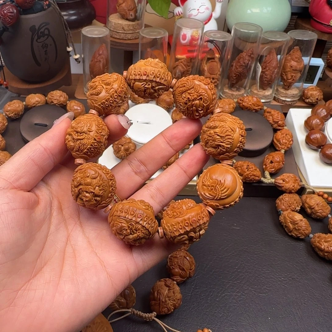 周***绕橄榄核吊坠九龙财神