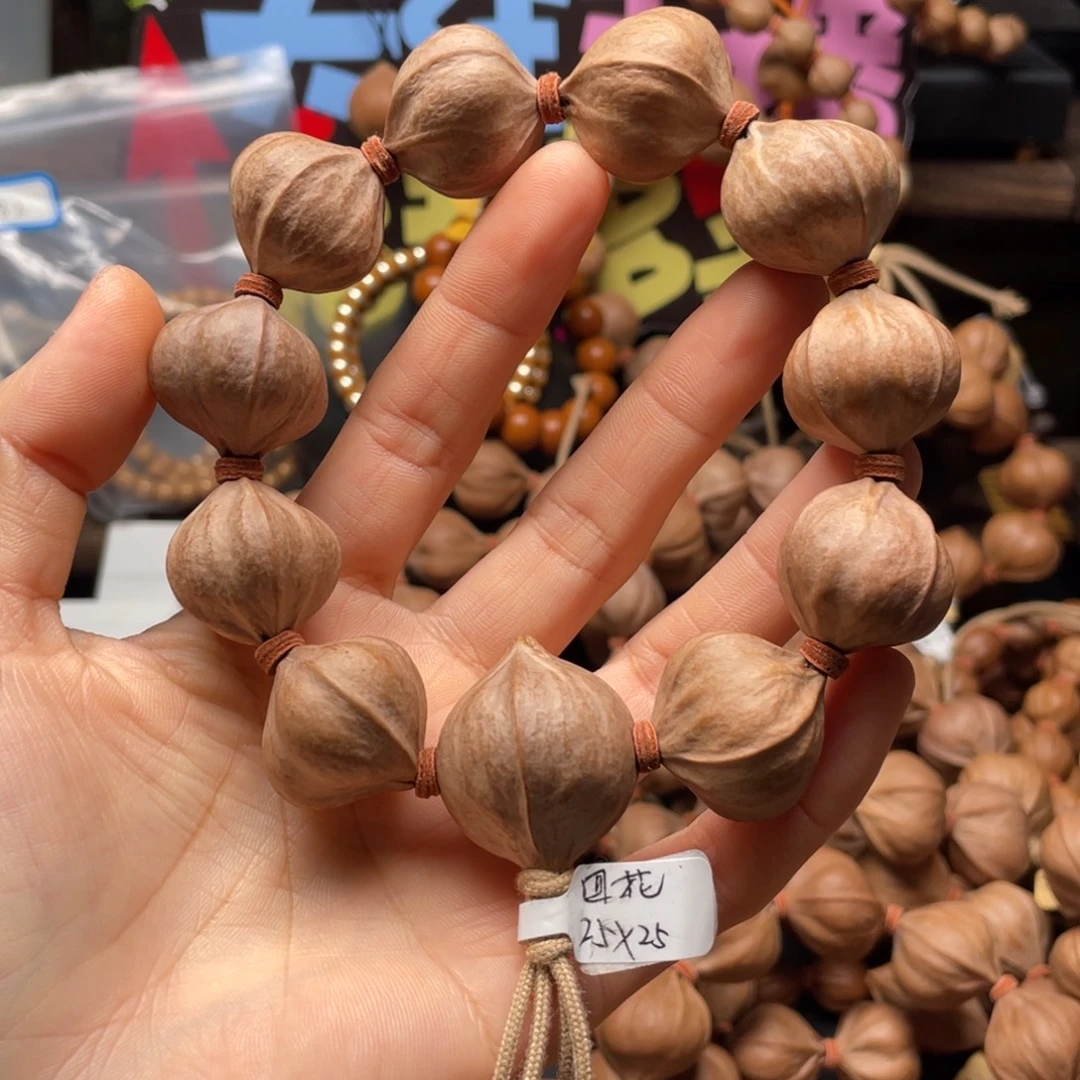 得***杜吊坠橄榄核2525四花铁核