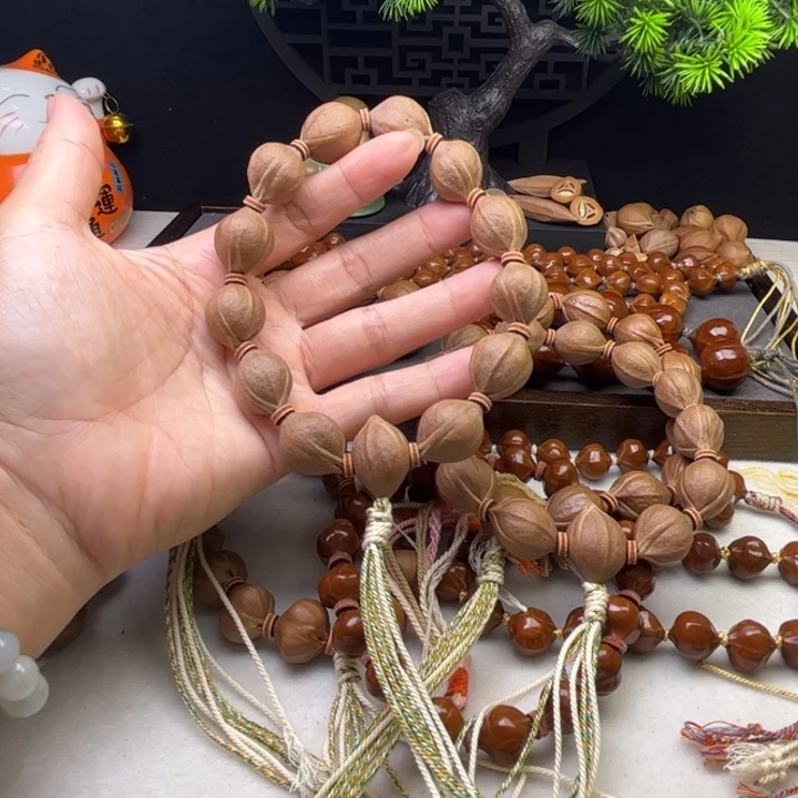 拾***光手串/手链橄榄核1.5*2.0原皮三花带三通铁核
