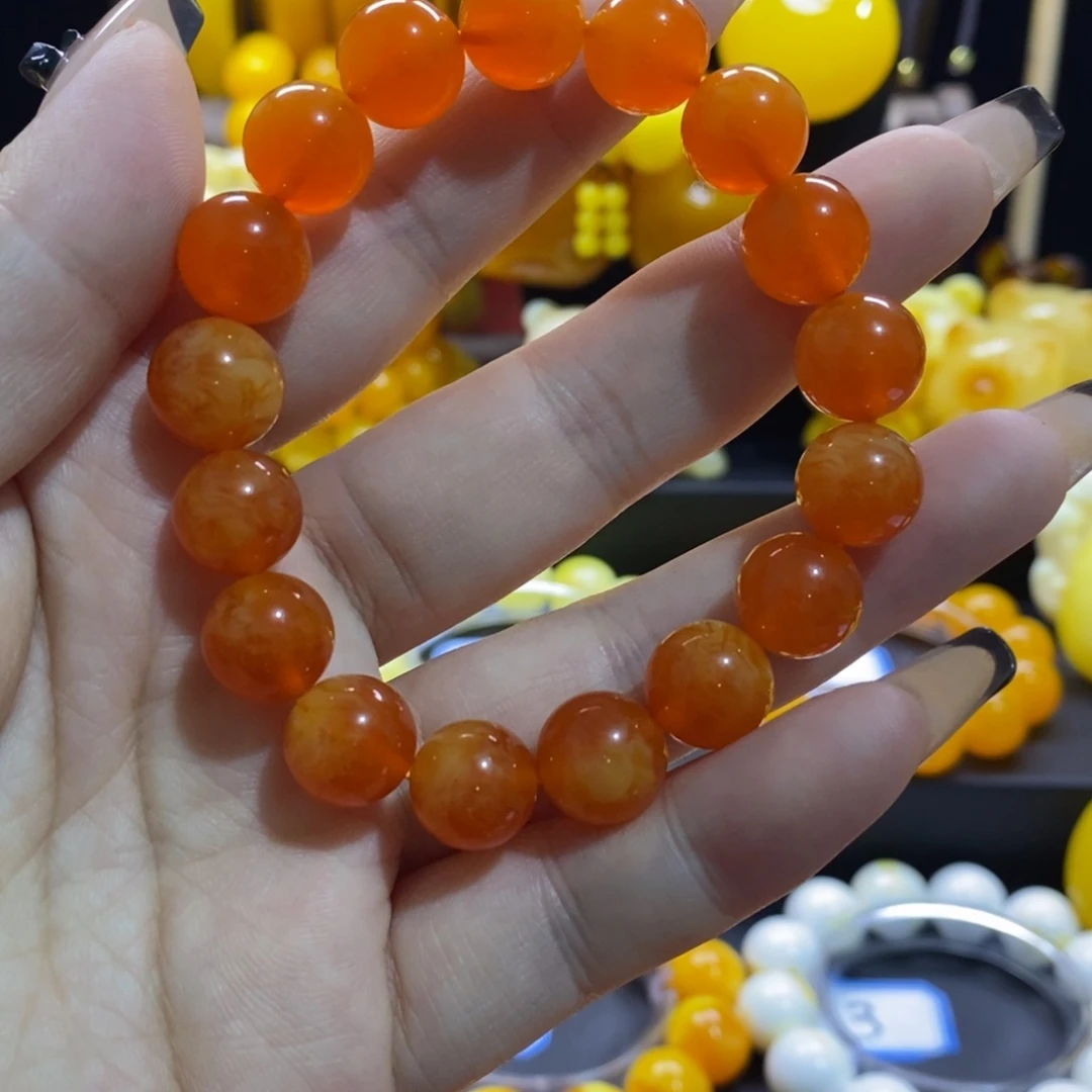 曼***快非金属蜜糖红手串12