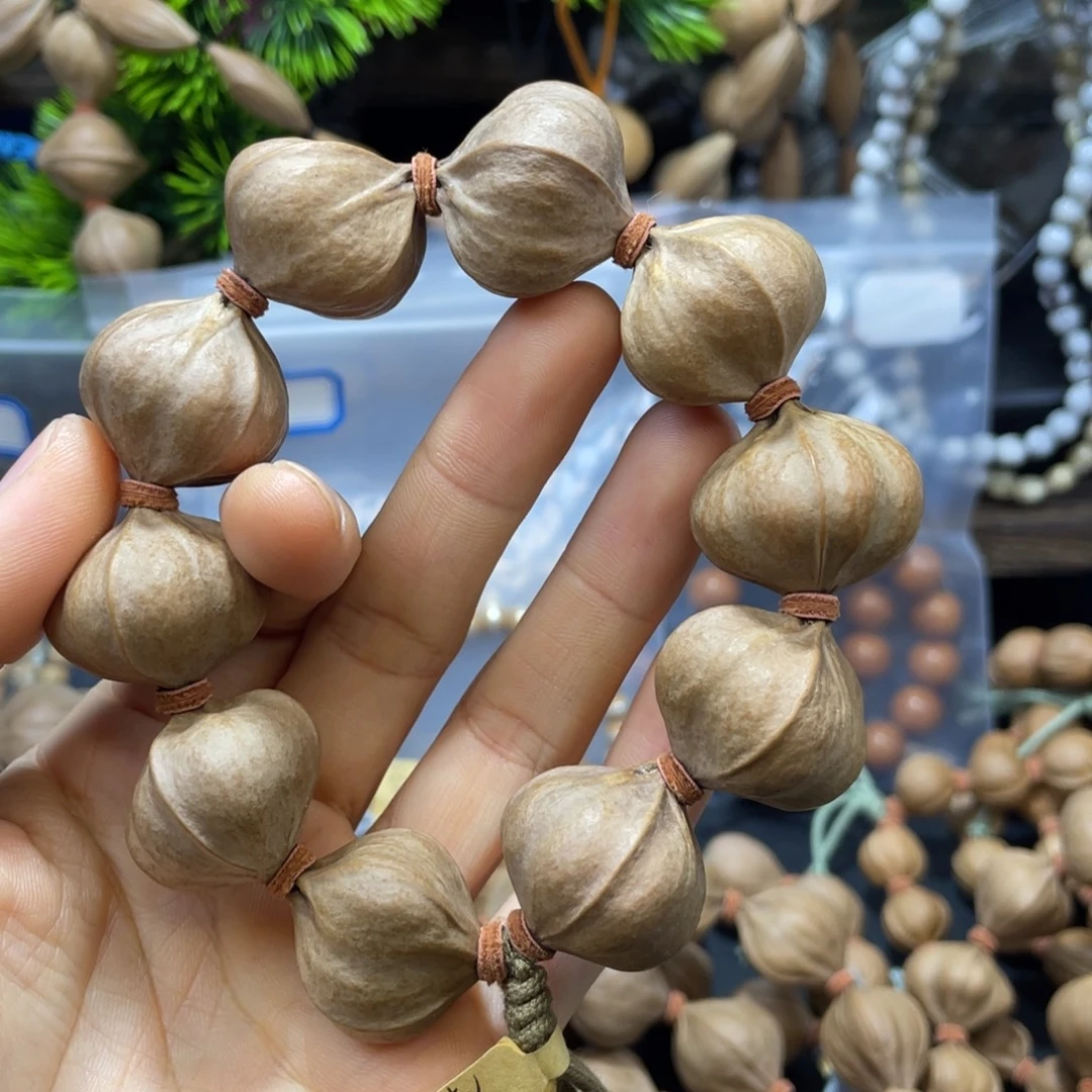 ****见吊坠橄榄核2724四花铁核