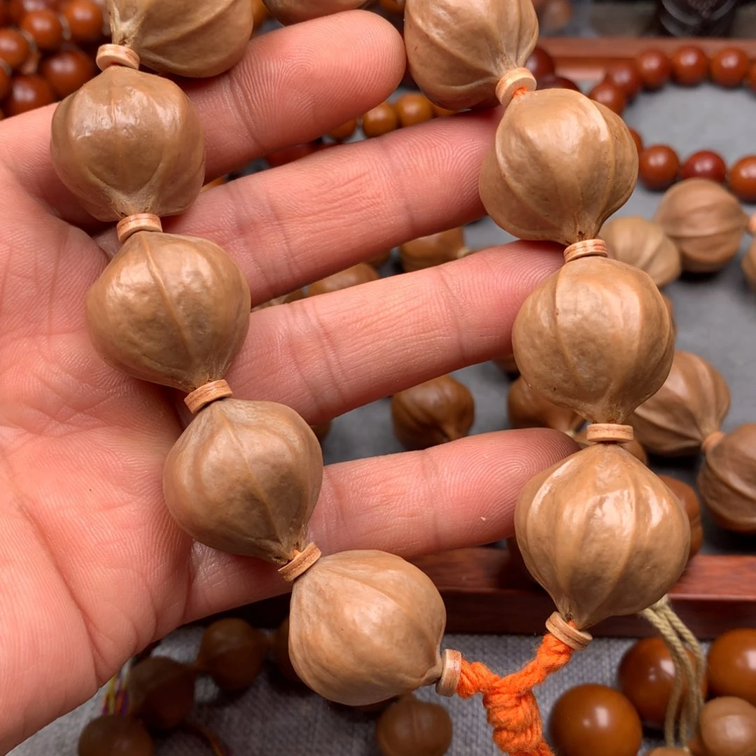 橄榄核手串阿*2.3四花素串