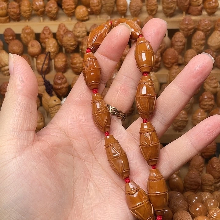 橄榄核吊坠竹子手持不退不换花皮特价