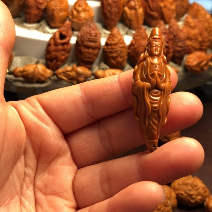 易***之橄榄核吊坠橄榄核雕刻的单子