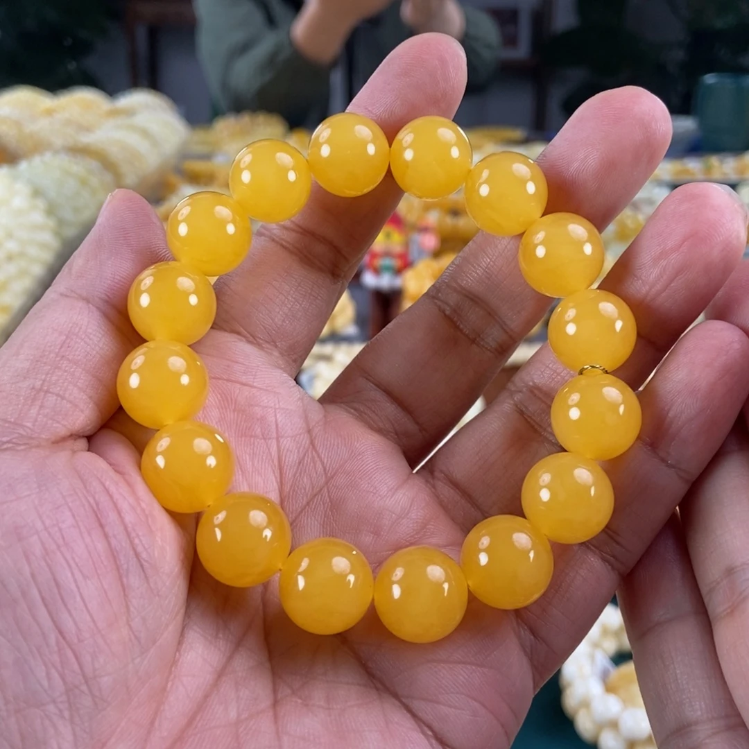 哎***歪琥珀未镶嵌珠宝奇石14鸡油红同料串26.35