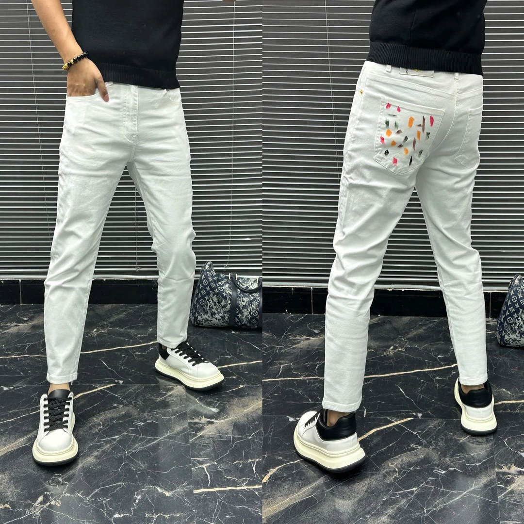2025新款潮牌小众设计感涂鸦白色九分牛仔裤男款潮牌小脚泼墨百搭