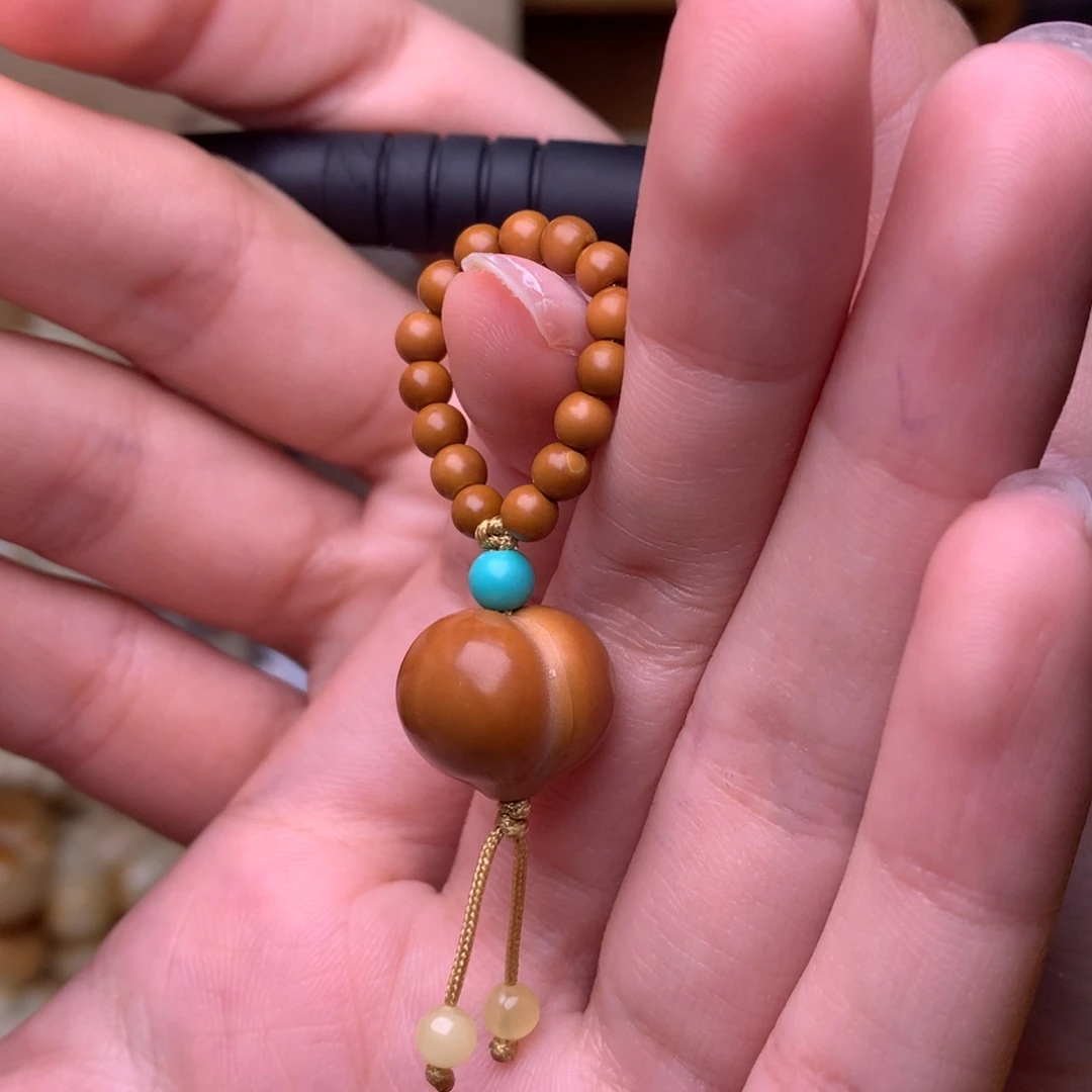 安***妮吊坠猴头核桃屁桃提溜