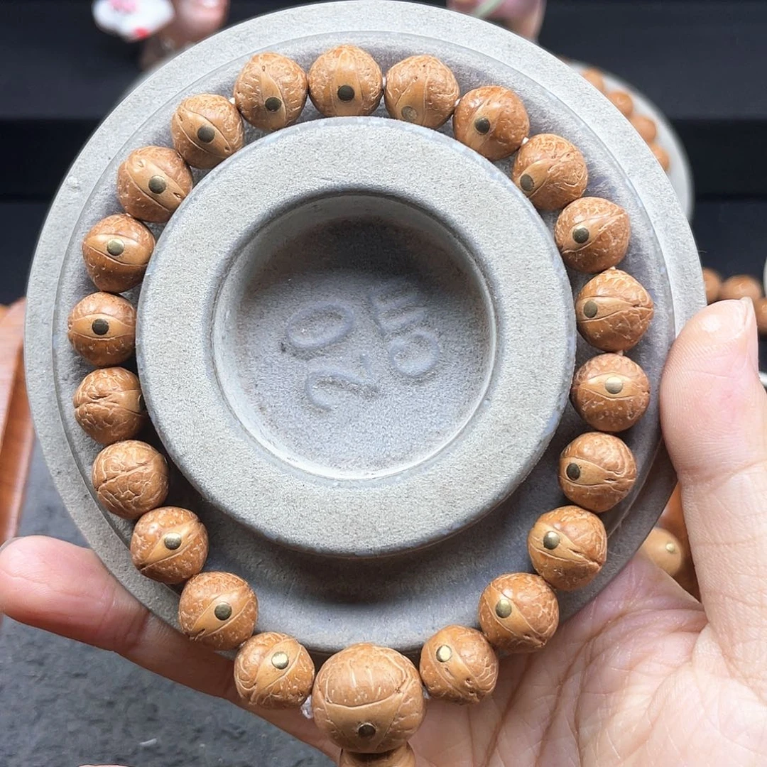 ↑***凤眼菩提手串L75-A01凤眼菩提小11+同树镶嵌黄皮