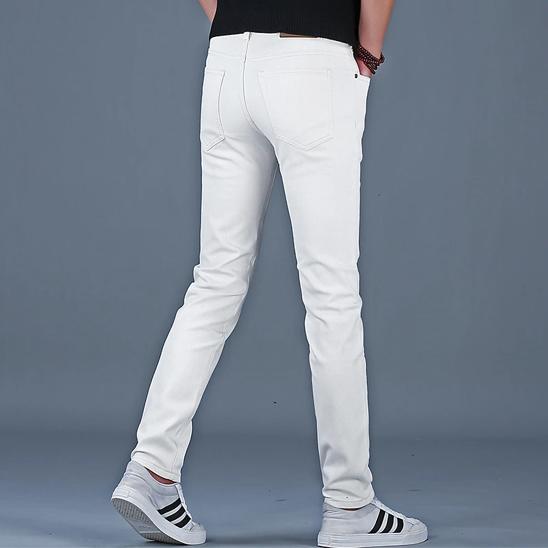 韩俊尼男士白色品牌牛仔裤夏薄款2025新款潮牌高端修身小脚裤休闲