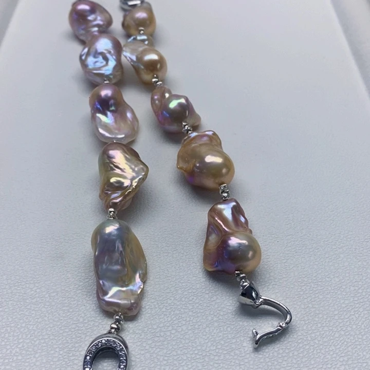 银S925镶嵌耳饰淡水珍珠人**醒