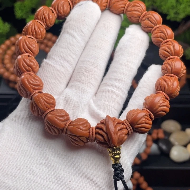 巅***R桃核吊坠精品小凤羽