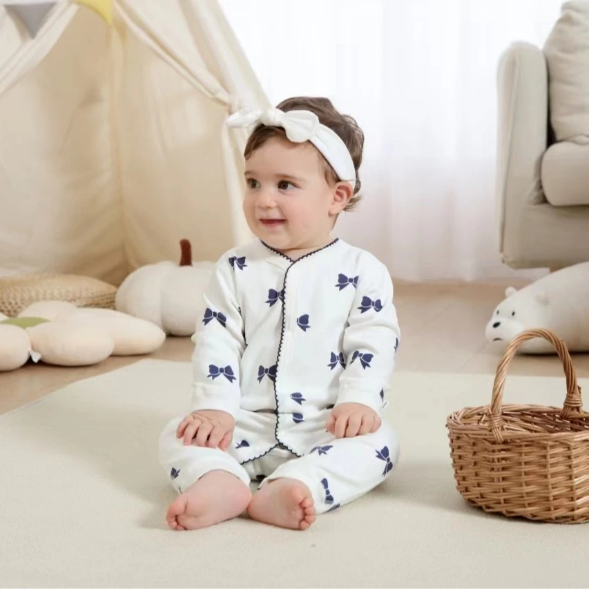 新生儿秋冬连体衣纯棉a类无骨宝宝蝴蝶结长袖婴儿睡衣哈衣爬服