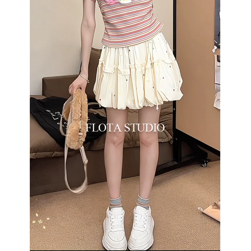 爱心刺绣奶杏色蓬蓬花苞裙A字甜美花边防走光显瘦设计小个子裙子