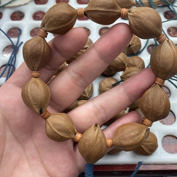 昕***昕吊坠橄榄核梅林铁核