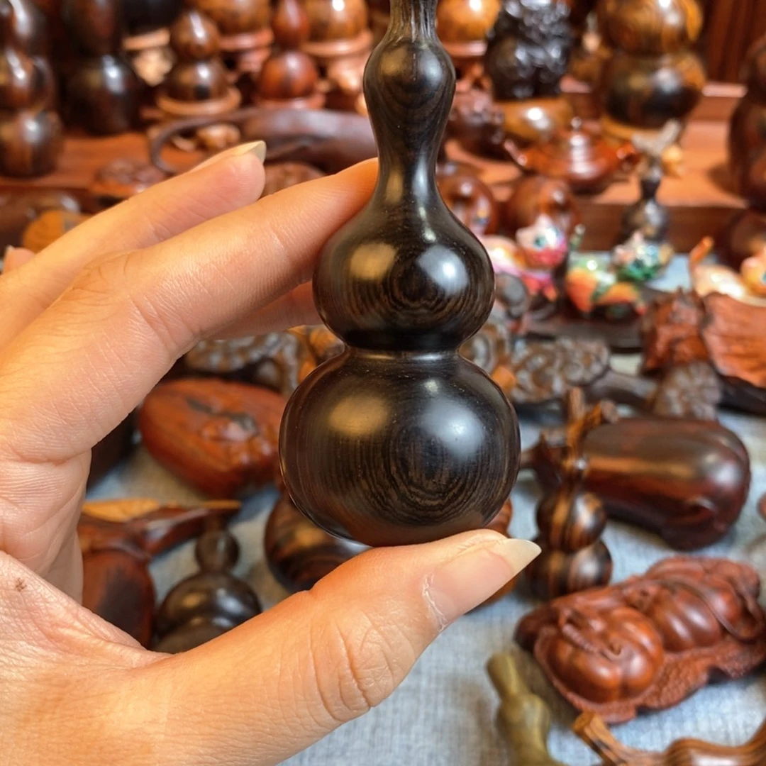 木春****年紫光檀葫芦手把件