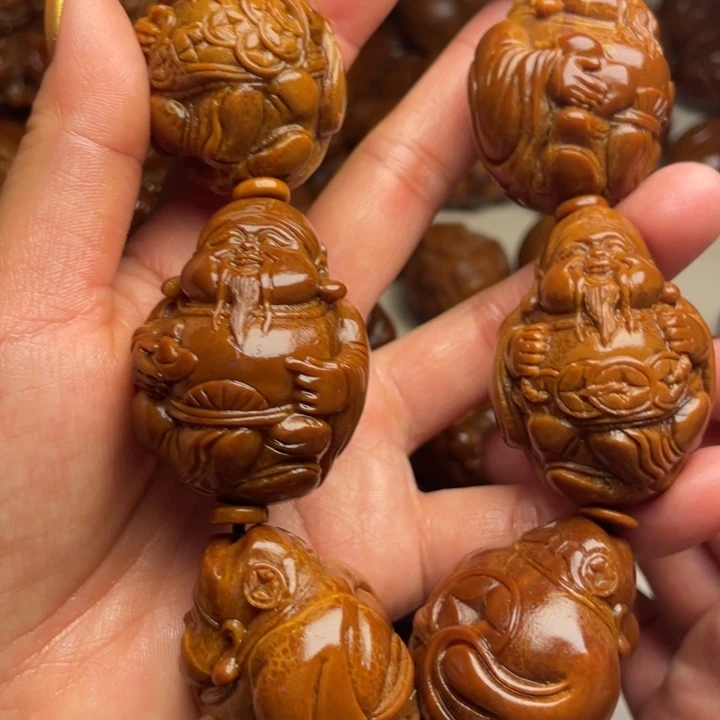 往***生橄榄核吊坠橄榄核手持