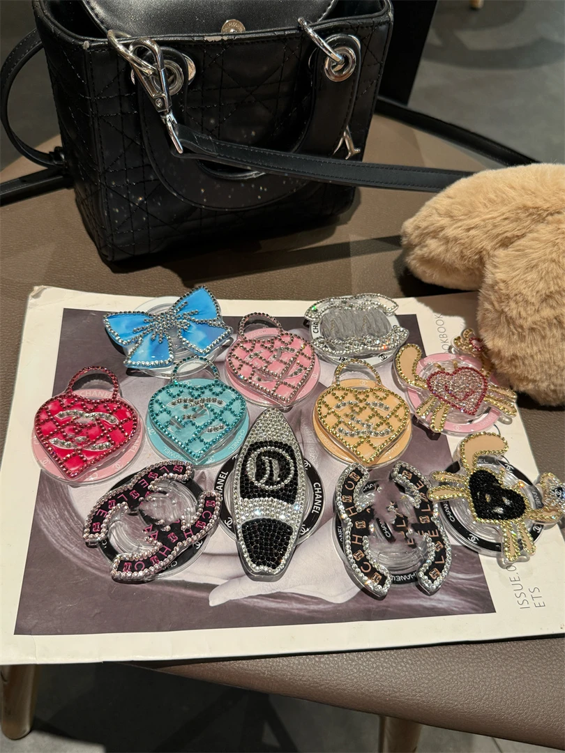 高定满钻轻奢潮牌磁吸支架适用苹果安卓手机通用可伸缩