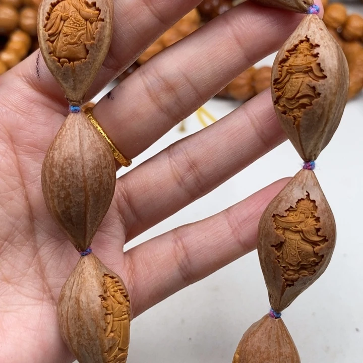 橄榄核吊坠包衣财神