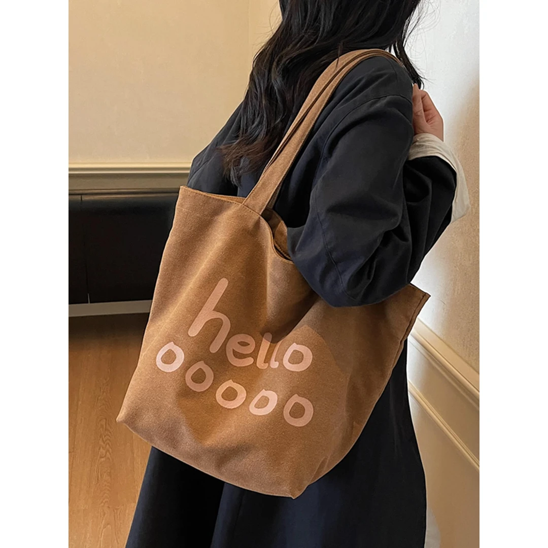 韩版字母帆布包女2025新款潮休闲大容量托特包简约通勤单肩购物袋