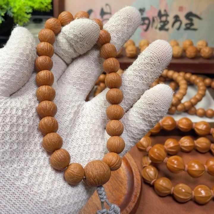 鹤***_猴头核桃手串凤羽