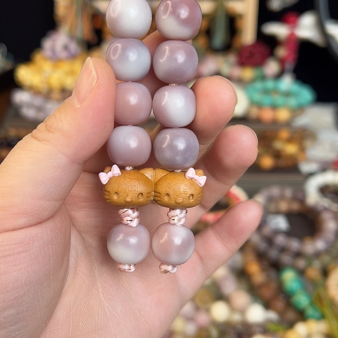 粉紫色KT手持。