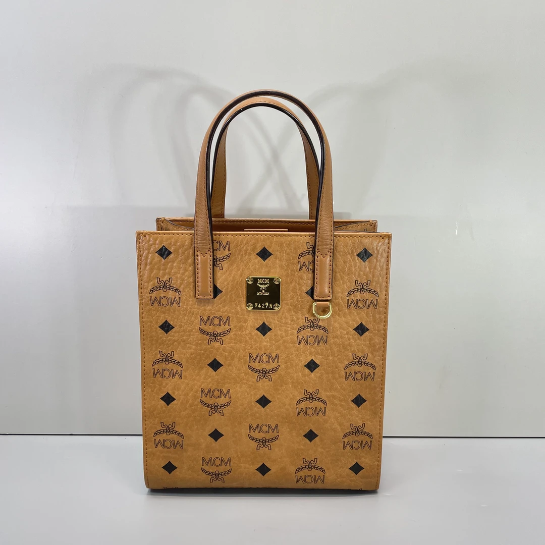 95新 MCM 媚姐/mcm干邑色小号琴谱包19*22*8cmSG021001
