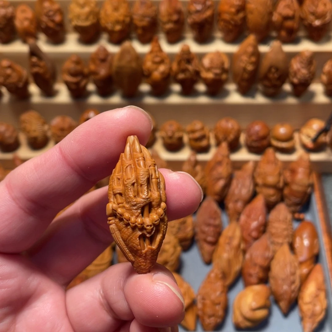 橄榄核把件佛魔手