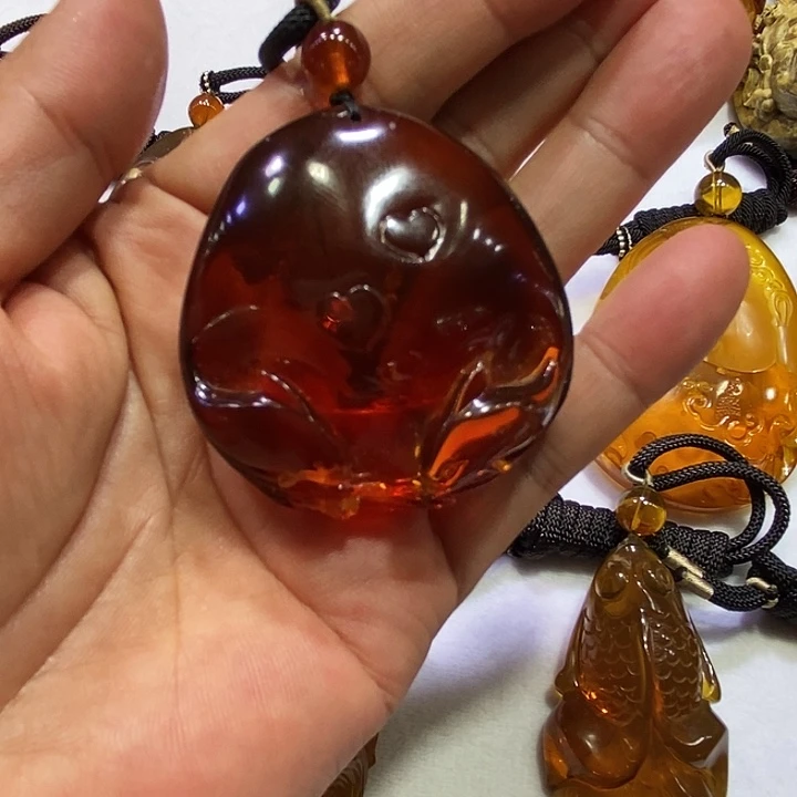 福***娃琥珀未镶嵌裸石24克酒红玻璃底血珀