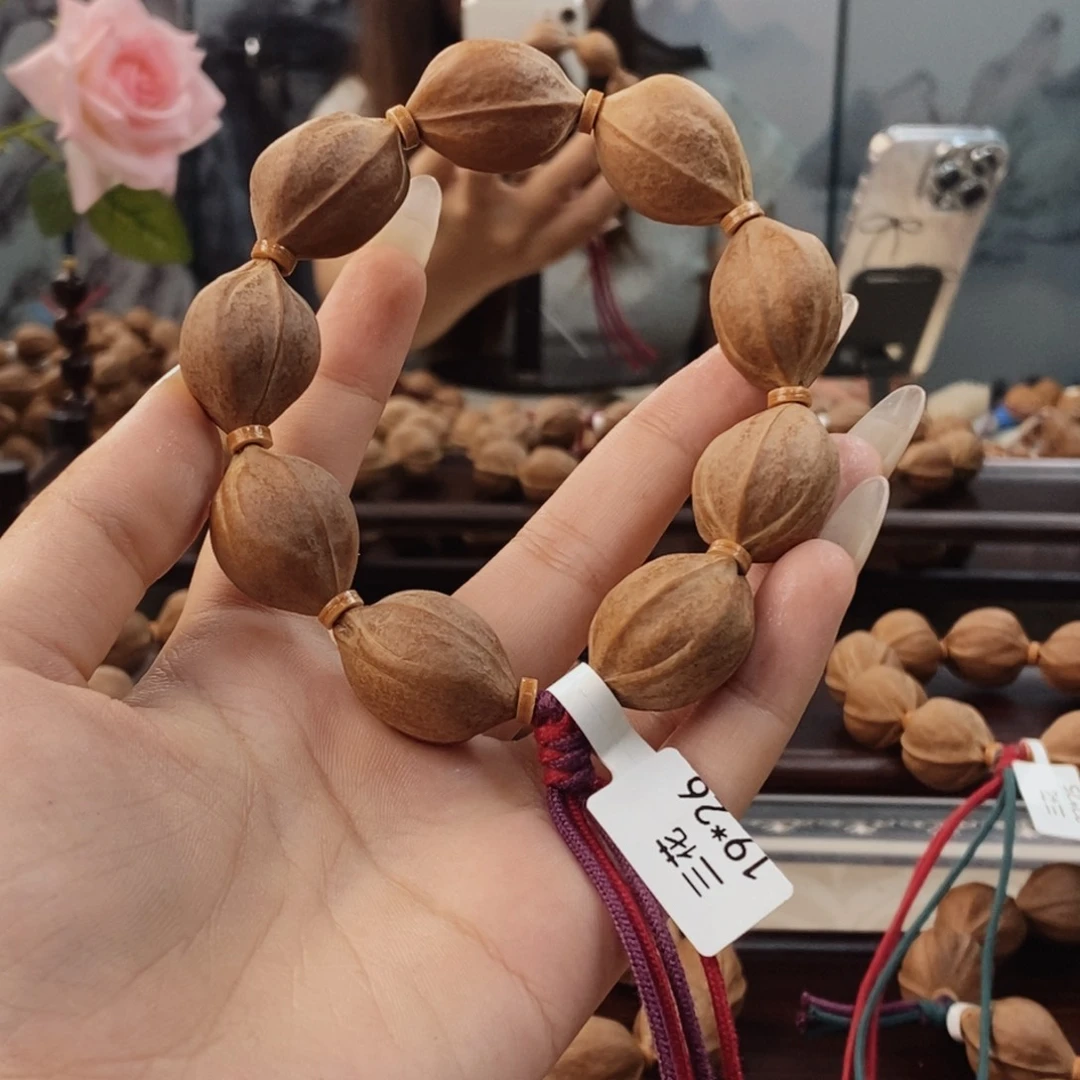 橄榄核吊坠那***天原生态正宗梅林铁核