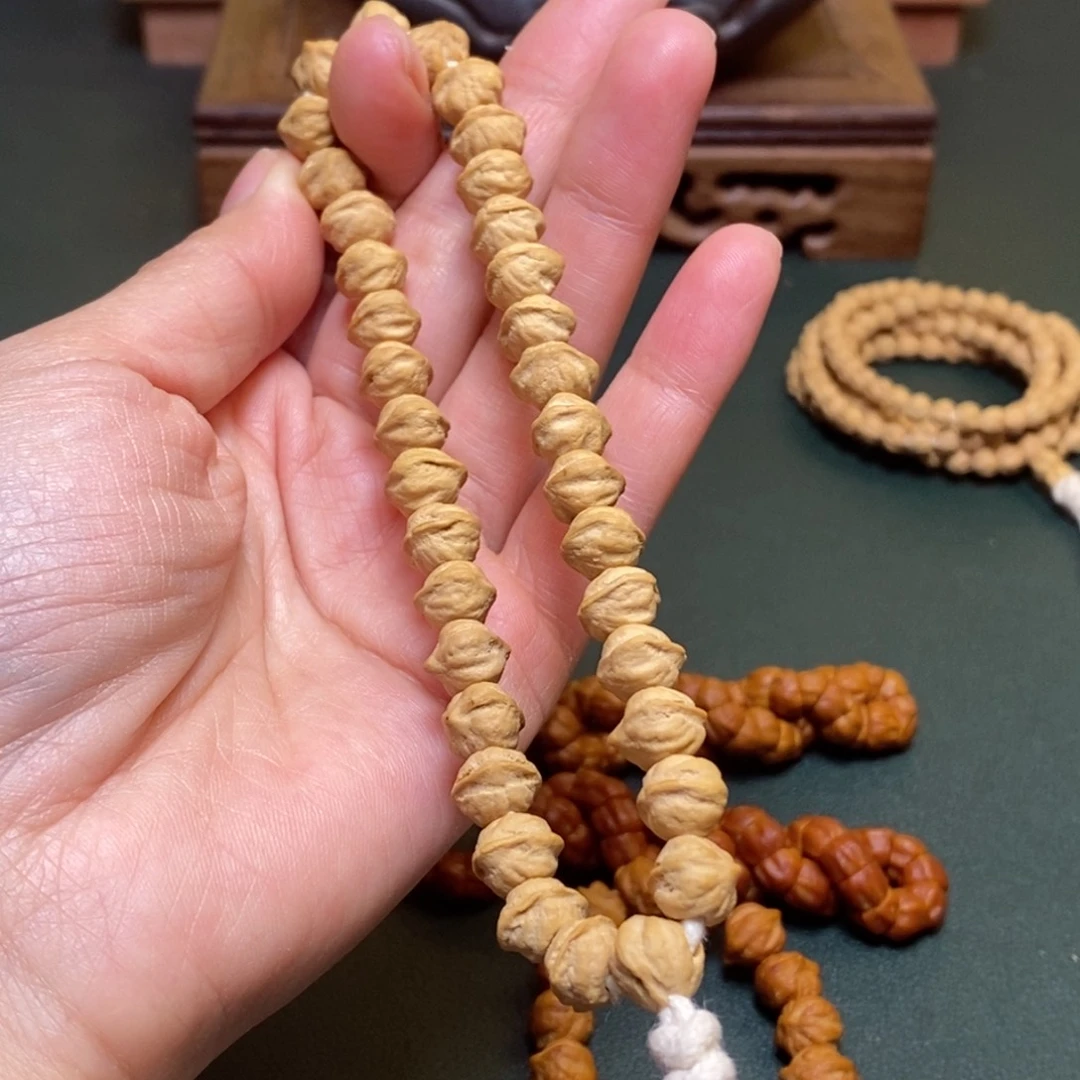 柏香籽/百香籽吊坠白牙手持