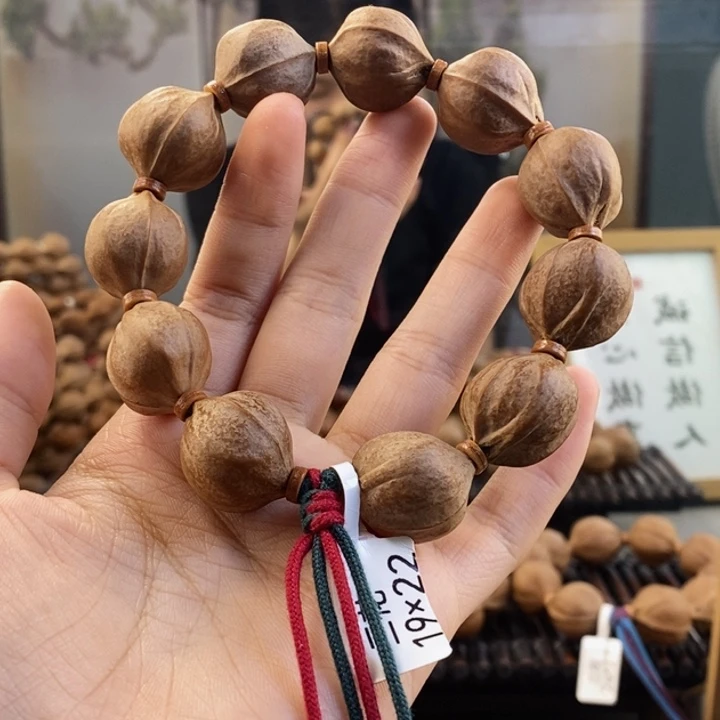 橄榄核吊坠丑****y梅林铁