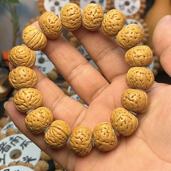 【闪购商品】阳****。桃核手串纽扣手串