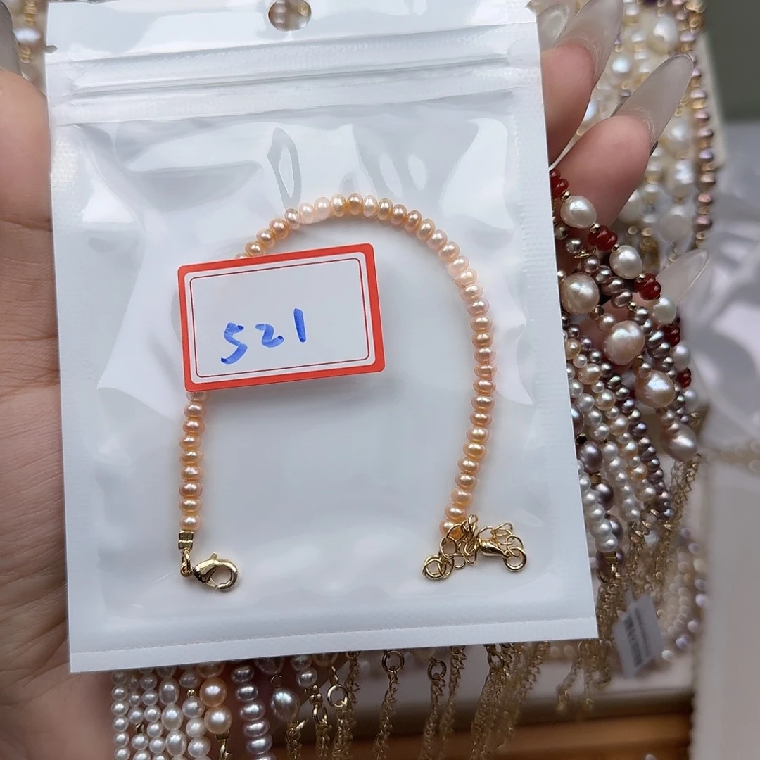 泗***粉淡水珍珠手绳钛钢
