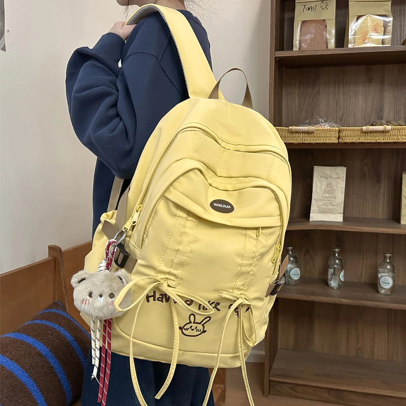 可爱蝴蝶结双肩包女中等容量学生书包小学初中大学生休闲双肩背包