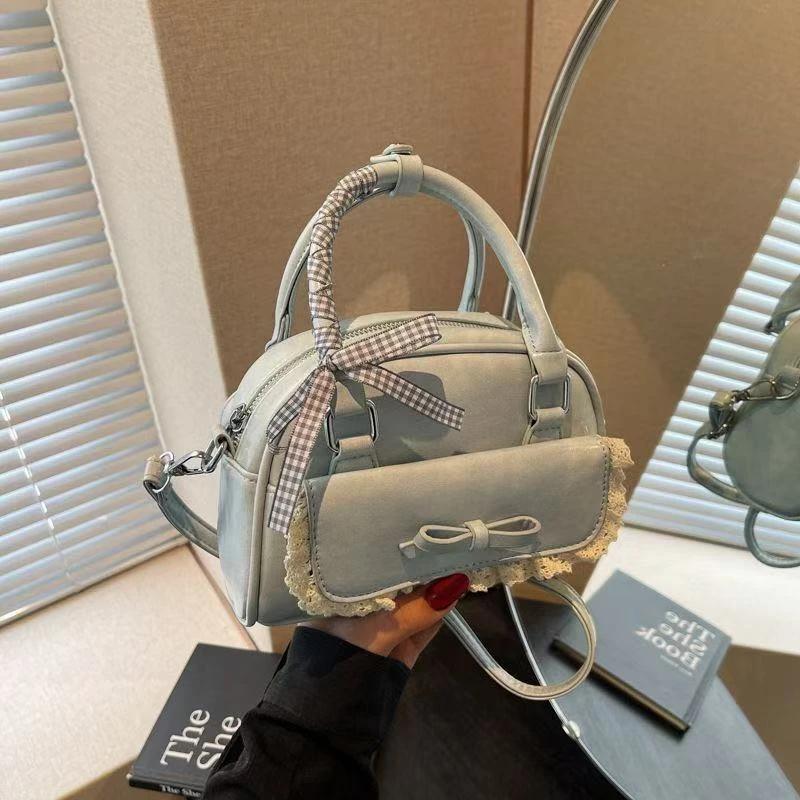 小众蝴蝶结包包女高颜值新款百搭斜挎包高级感手提保龄球包