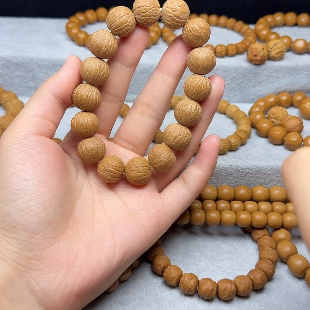 猴头核桃手串凤羽原皮原籽