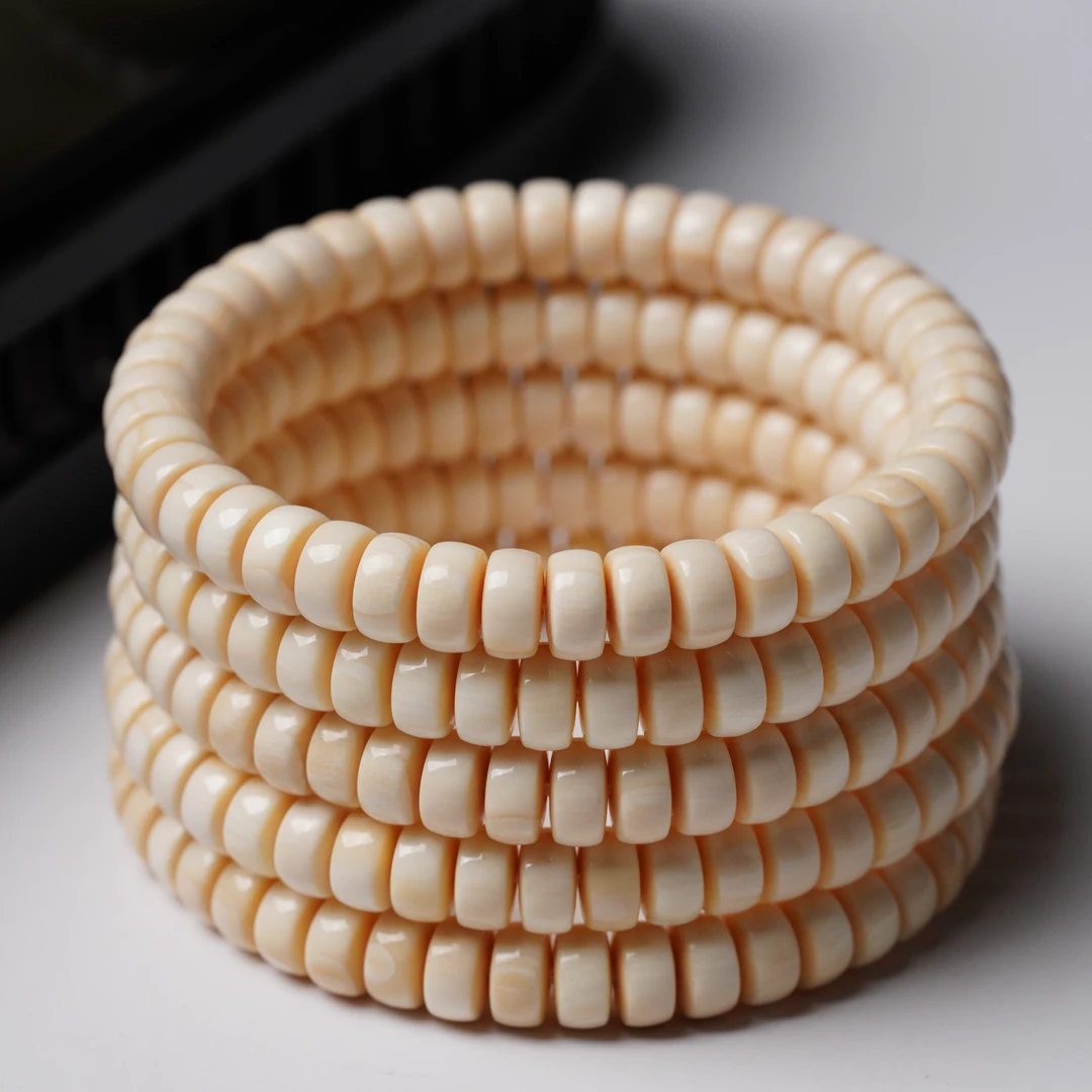 C002-O天然猛犸牙精工皮珠药片8×4mm 随机一个发货