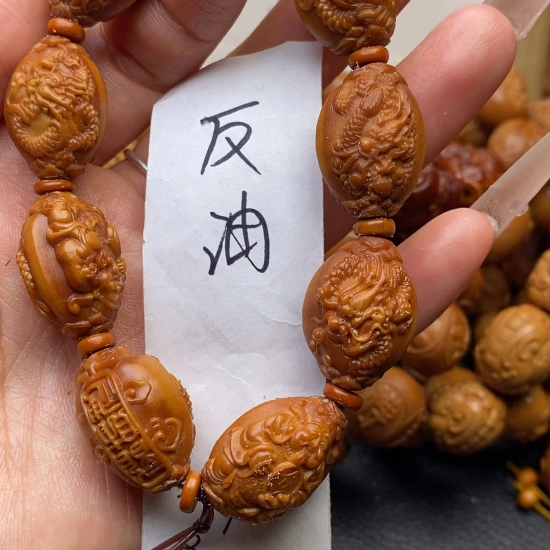 橄榄核手串小尺寸龙财神